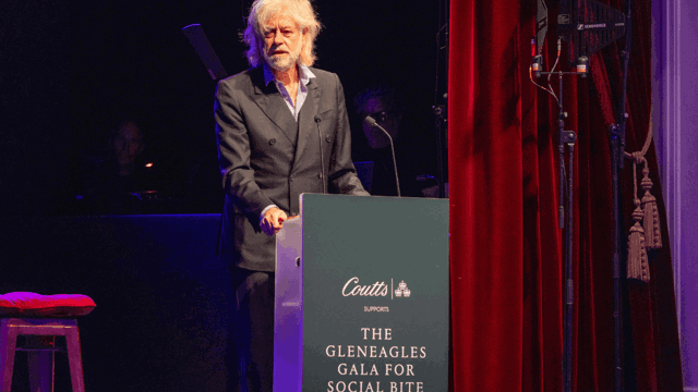 Bob Geldof speaks at a lectern that reads The Gleneagles Gala for Social Bite