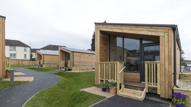 Photo of a NestHouse at the South Lanarkshire Social Bite Village, with other houses in the background. 