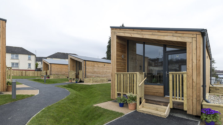 Photo of a NestHouse at the South Lanarkshire Social Bite Village, with other houses in the background. 