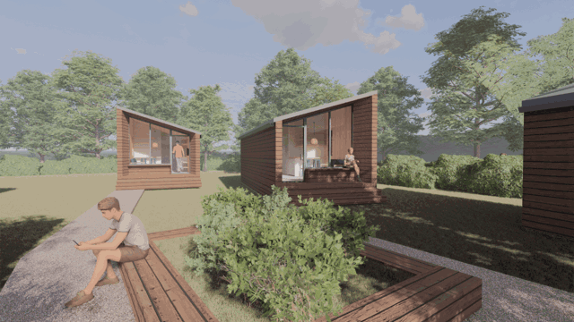 A computer generated image of wooden cabin style houses in a green area